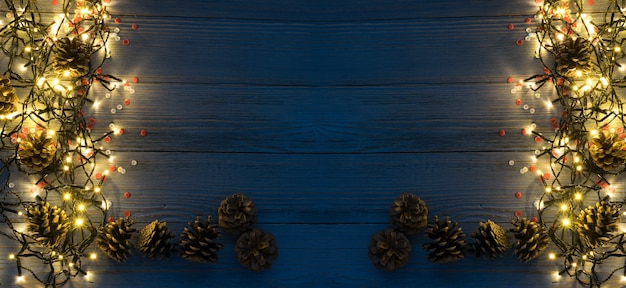 Christmas Light on Wooden Background Top View with Copyspace