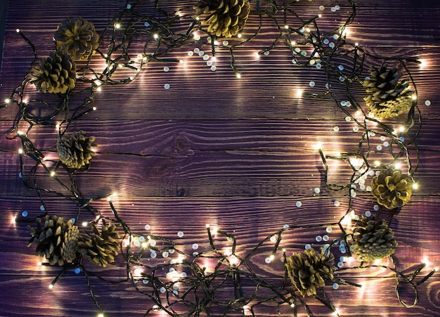 Christmas Light on Wooden Background Top View with Copyspace