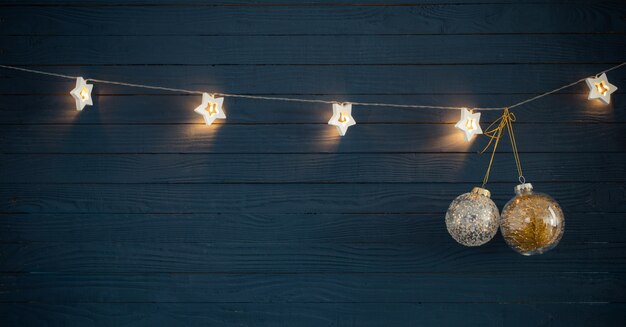 Christmas lights on blue wooden