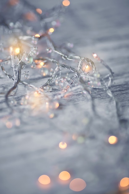 Christmas lights bokeh on a wooden background