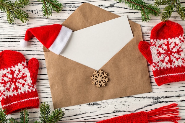 Christmas mail, envelopes with letters on a light wooden table