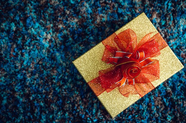 Christmas many gifts on blue carpet interior of top view with Background with Copy Space,Decoration During Christmas and New Year.