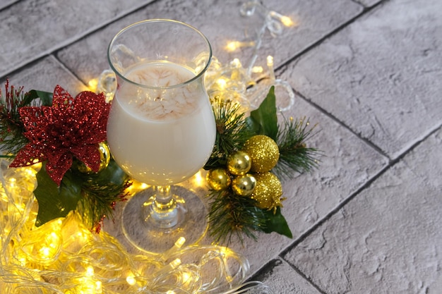 Christmas milk in a glass for Santa Claus, close up, selective focus.