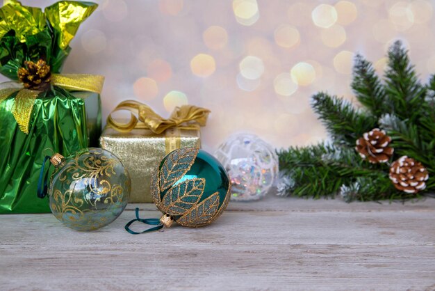 Christmas mood New Year background Christmas fir gifts Christmas balls on a wooden table Holiday atmosphere