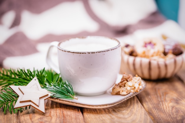 Christmas mood with coffee cappuccino and homemade cookies