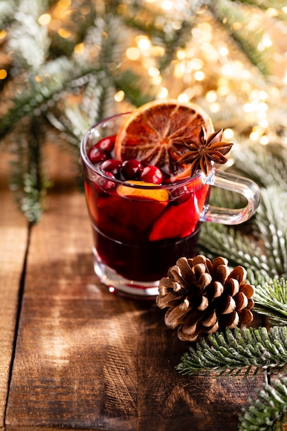 Christmas mulled wine with spices on a wooden rustic table