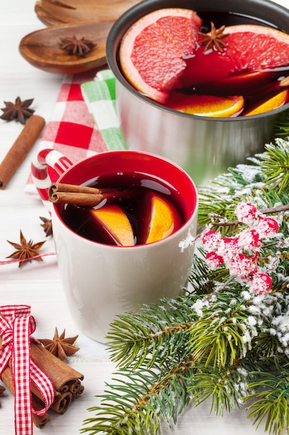 Christmas mulled wine on wooden table closeup