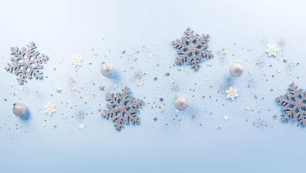 Christmas and new year background concept Top view of Christmas ball star and snowflake on pastel blue background