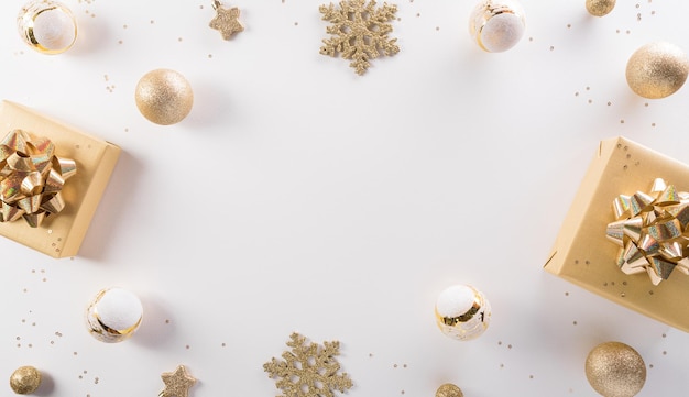 Christmas and new year background concept. Top view of Christmas gift box, christmas ball and snowflake on white background.