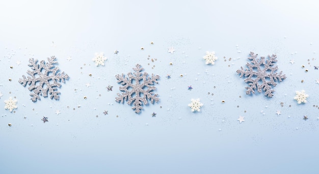 Christmas and new year background concept Top view of Christmas star and snowflake on pastel blue background