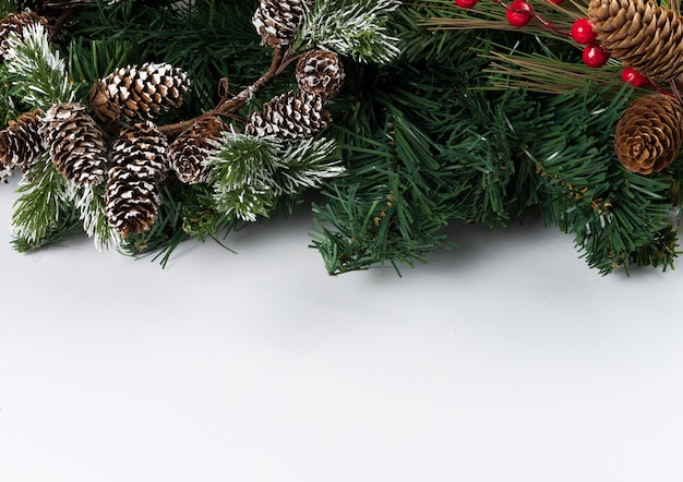 Christmas new year composition on white background. Fir branches, christmas decoration. Flat lay, top view, copy space.