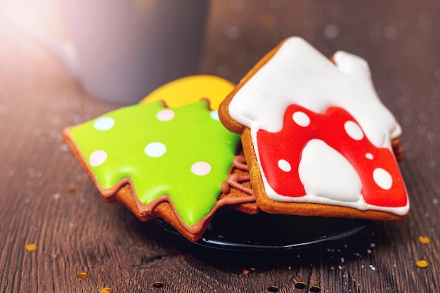 Christmas and New Year cookies on a plate on a wooden table