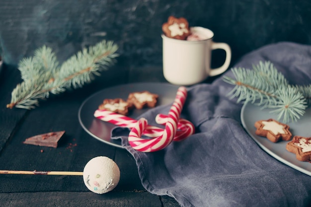 Christmas New Year a cup of coffee with meringues and marshmallows caramel candies