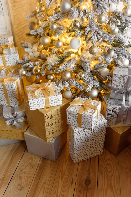 Christmas and New Year decorated interior room with presents and New year tree