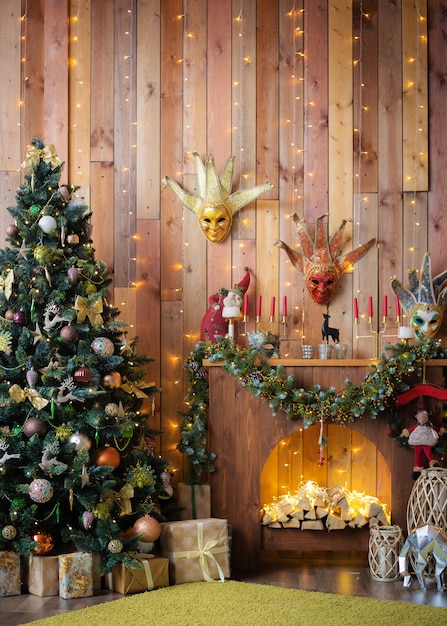 Christmas and New Year decorated the interior wooden room with gifts and a Christmas tree