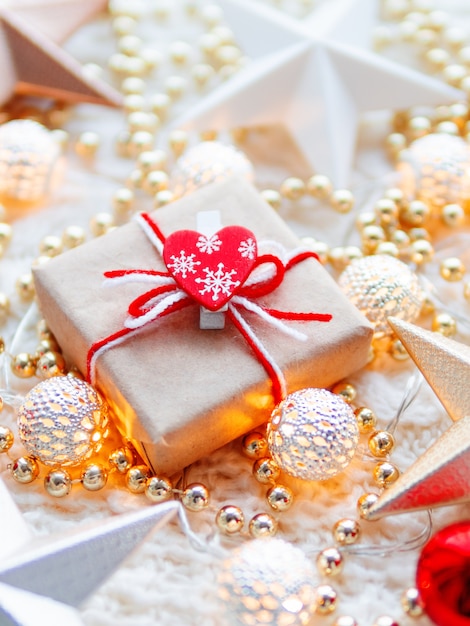 Christmas and New Year star decorations on white knitted background.