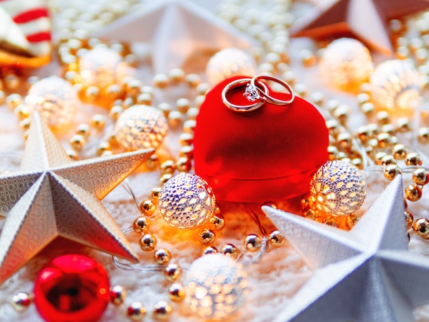 Christmas and New Year star decorations on white knitted background. 