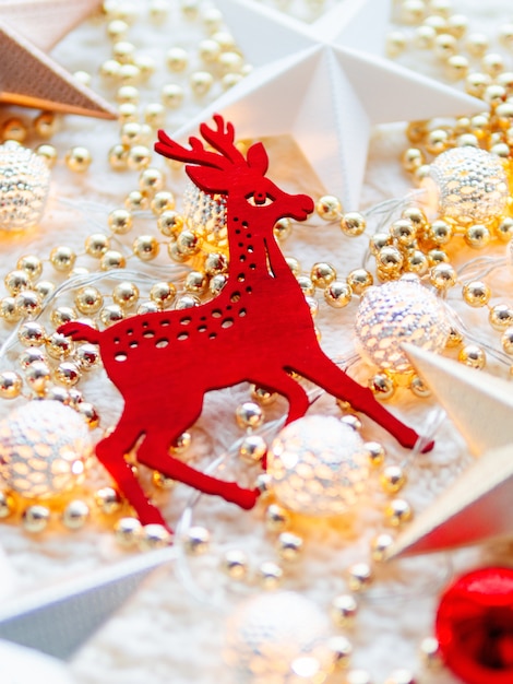 Christmas and New Year star decorations on white knitted