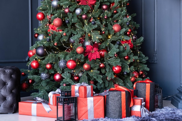 Christmas New Year tree with gifts in the room