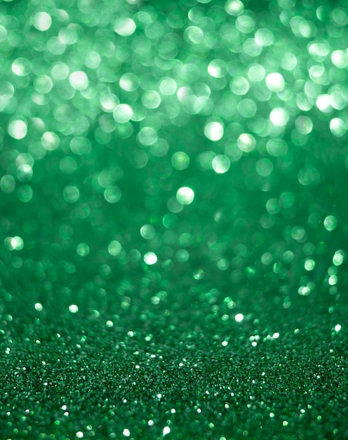 Christmas and New Years holiday vertical green bokeh background with copy space.