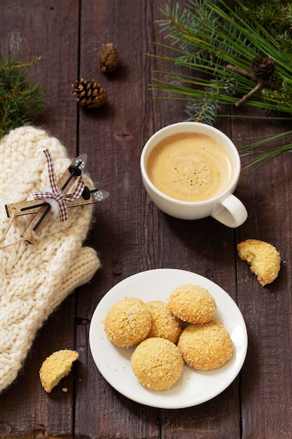 Christmas nut cookies filbertines served with coffee on a background of christmas decorations