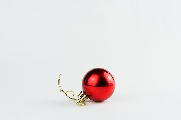 Christmas ornament isolated on white background. Polka dots to hang on Christmas trees to celebrate the arrival of Santa Claus. Red ball.