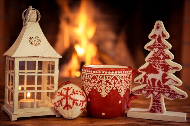 Christmas ornament near fireplace. Winter holiday concept