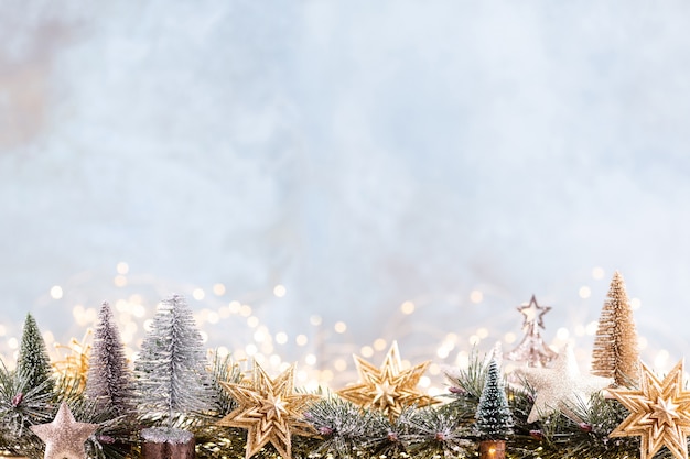 Christmas ornament with string lights on blue background.