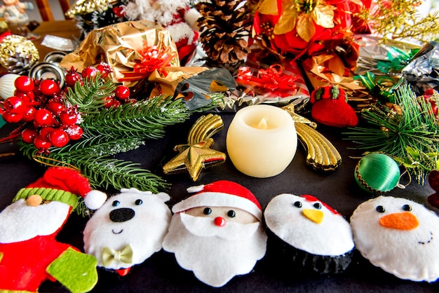 Christmas ornaments and gifts on black background.