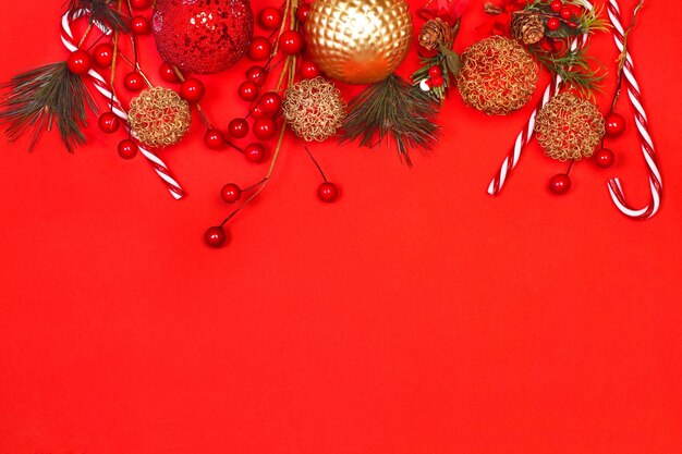 Christmas ornaments on a red background with copy space