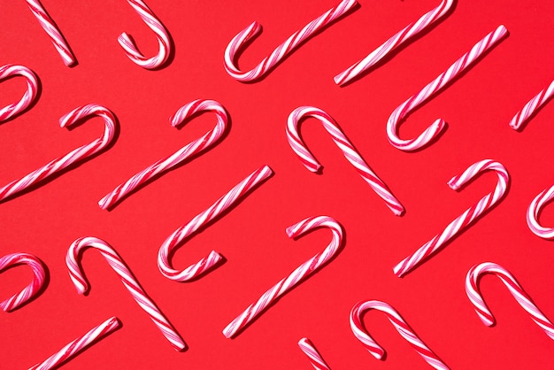 Christmas pattern of candy cane on red background