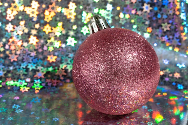 Christmas pink ball on a beautiful shiny background