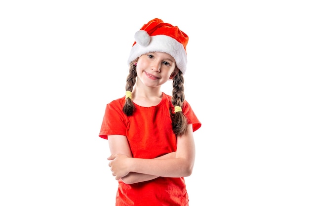 Christmas portrait of cute little girl wearing a santa hat isolated on white background