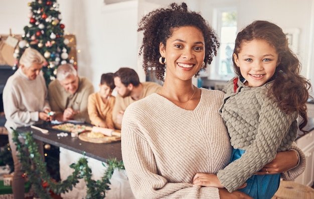 Christmas portrait and mother with girl happy together and bonding in home Xmas smile and face of kid with African mom interracial and adoption at family party celebration and winter holiday