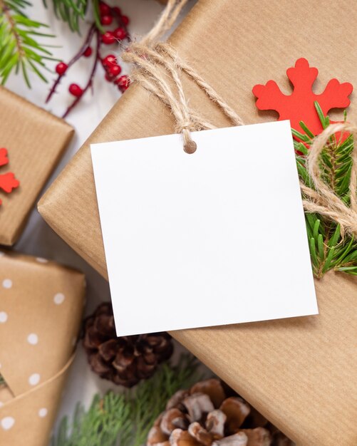 Christmas present with square blank gift tag top view, Mockup