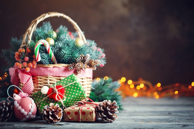 Christmas presents in a basket with fir branches