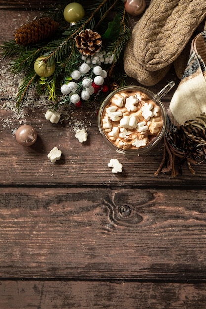 Christmas presents and hot cocoa with marshmallows on the wooden table Top view with copy space