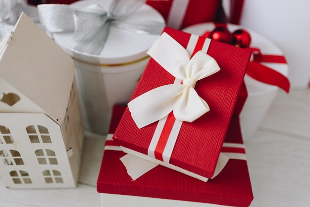 Christmas presents in red and white boxes with ribbons