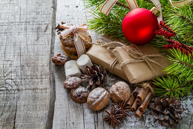 Christmas presents and symbols, rustic wood background