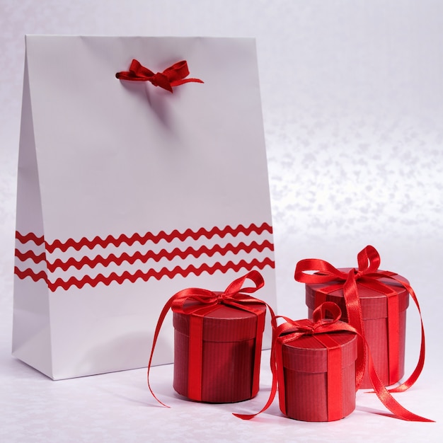 Christmas Red boxes for gifts tied bows with paper bag