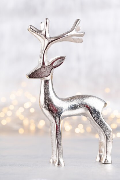 Photo christmas reindeer on bokeh silver background