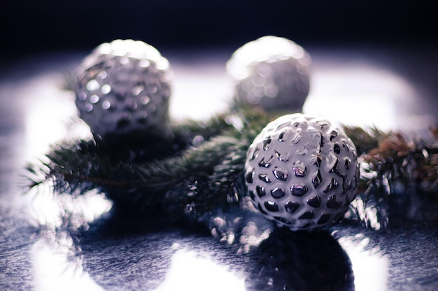 Christmas silver balls on Christmas tree branch Bokeh effect Premium photo