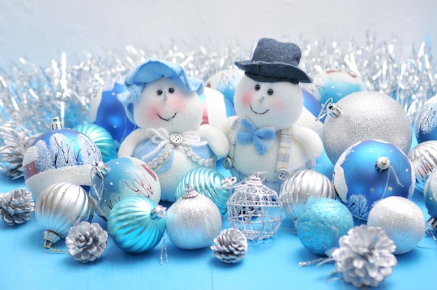 Christmas Snowman and Snow Maiden surrounded by New Year's toys