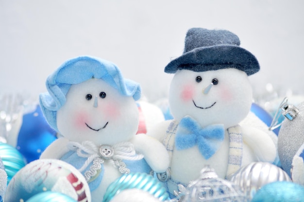 Christmas Snowman and Snow Maiden surrounded by New Year's toys