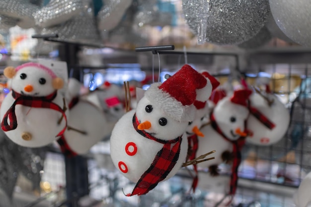 Christmas snowmen on the Christmas tree in the supermarket