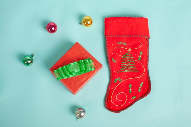 Christmas sock and christmas decoration isolated on blue backgrund