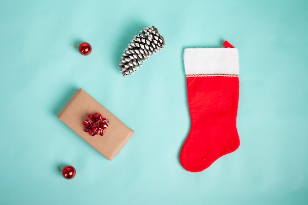 Christmas sock and christmas decoration isolated on blue backgrund