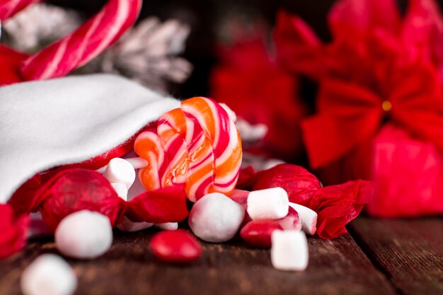 Christmas socks full of candy and sweets. Closeup of candies. Macro.