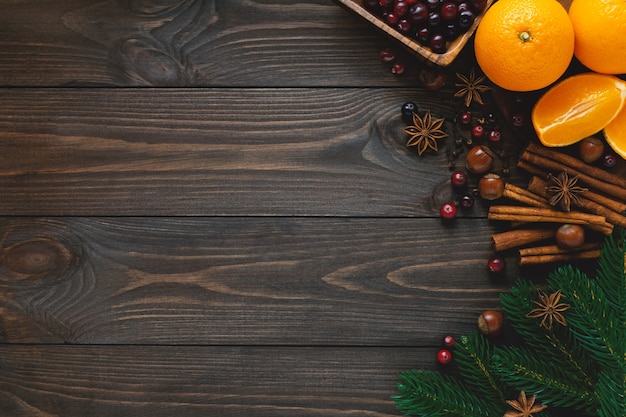 Christmas spices for drinks and cooking on wooden table