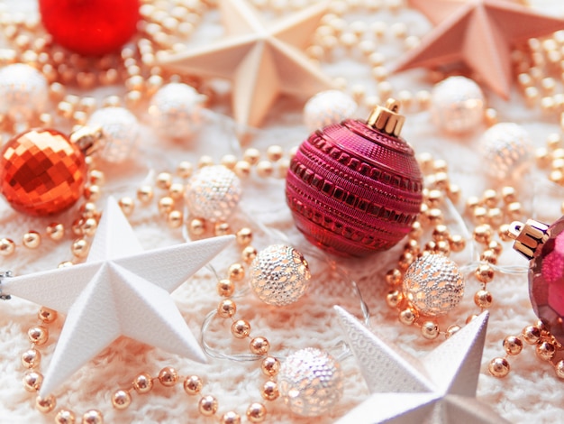 Christmas  star decorations on white knitted . 